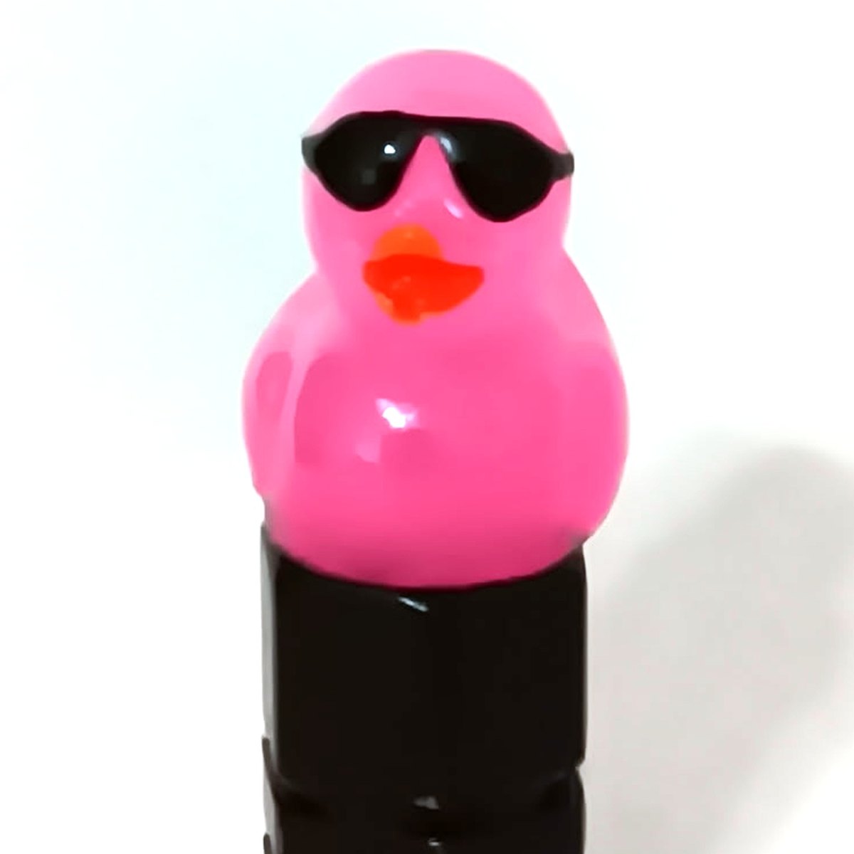 Hot pink duck valve stem cap wearing tiny sunglasses