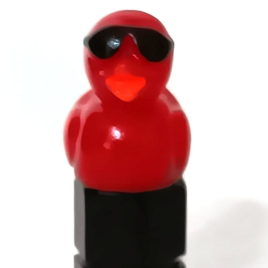 Red duck valve stem cap wearing tiny sunglasses